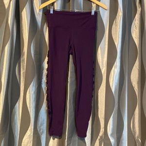 Athlete purple yoga pants with side cutouts